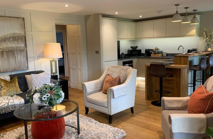 Sitting area with kitchen area in background at Brunel House apartment