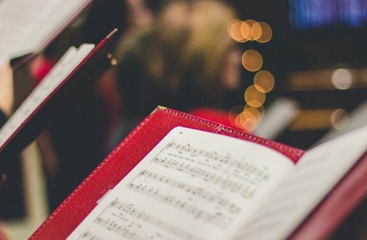 Members of a choir holding music
