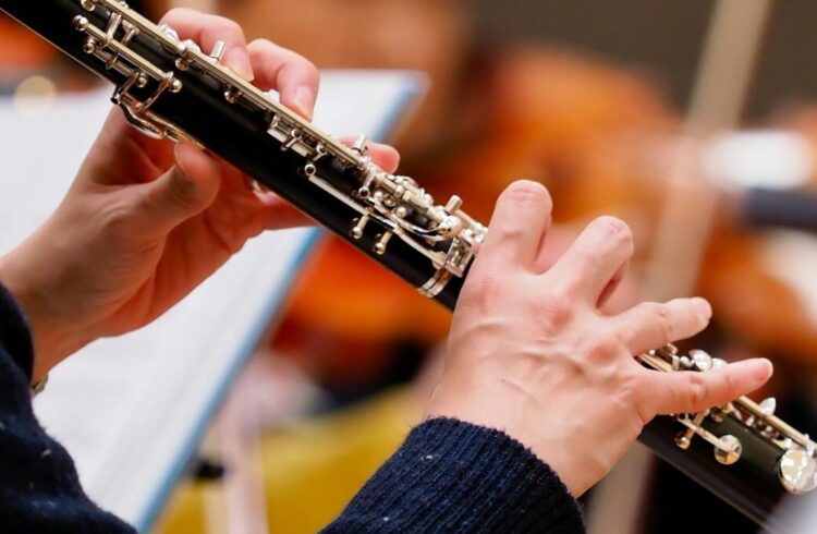 A musician playing an oboe