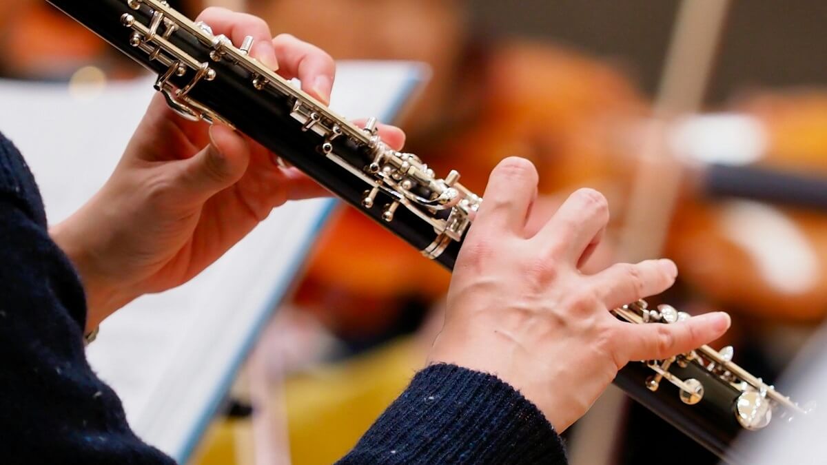 A musician playing an oboe